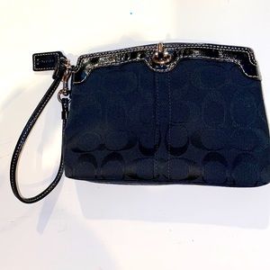 Vintage coach signature wristlet, used once.